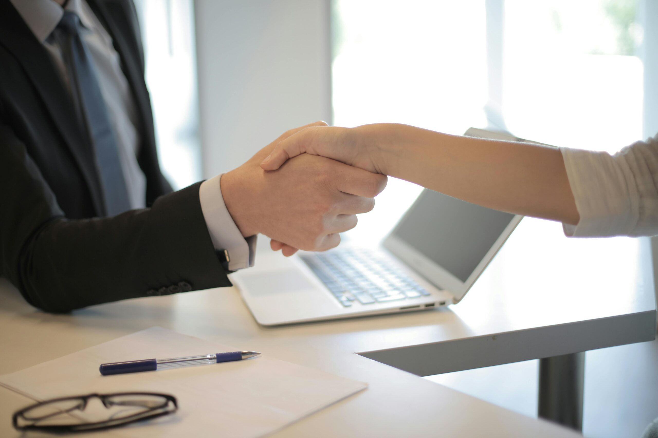 handshake or agreement between employer and employee
